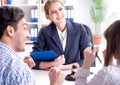 Young family signing marriage documents at laywers office Royalty Free Stock Photo