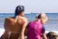 Young family sitting at the beach and enjoying their holiday Royalty Free Stock Photo