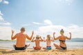 A young family is sitting in a contemplative stance