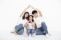 Young family sitting on floor with home concept Royalty Free Stock Photo