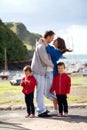 Young family with small kids on a harbor in the afternoon Royalty Free Stock Photo