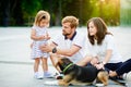 Young family spending a day off in the city park. Royalty Free Stock Photo