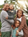 Were one happy family. a young family standing outside together and posing in their garden. Royalty Free Stock Photo