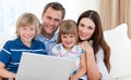 Young family surfing the internet Royalty Free Stock Photo