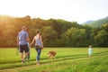 Young family with their pet dog, golden retriever Royalty Free Stock Photo