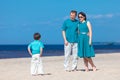 Young family of three having fun tropical beach Royalty Free Stock Photo