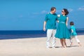 Young family of three having fun tropical beach Royalty Free Stock Photo