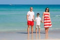 Young family of three having fun tropical beach, Koh Phangan island, Thailand Royalty Free Stock Photo