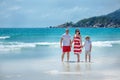 Young family of three having fun tropical beach Royalty Free Stock Photo