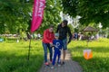 A young family of three people at the start of the route