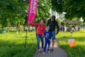 A young family of three people at the start of the route