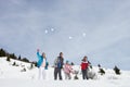 Young Family Throwing Snowballs Royalty Free Stock Photo