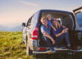Young family travelling by car in mountains during summer vacation Royalty Free Stock Photo