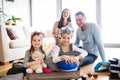 Young family with two children packing for holiday. Royalty Free Stock Photo