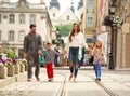 Young family with two kids walking street old tourist city Royalty Free Stock Photo