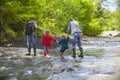 Young family with two little daughters on mountain trek Royalty Free Stock Photo