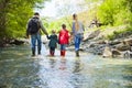 Young family with two little daughters on mountain trek Royalty Free Stock Photo