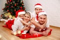 Young family with two small children. Happy family smiling to camera Royalty Free Stock Photo
