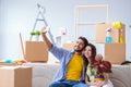 The young family unpacking at new house with boxes Royalty Free Stock Photo