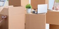Young family unpacking at new house with boxes Royalty Free Stock Photo