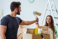 Young family unpacking at new house with boxes Royalty Free Stock Photo