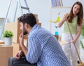 The young family unpacking at new house with boxes Royalty Free Stock Photo