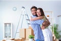 The young family unpacking at new house with boxes Royalty Free Stock Photo