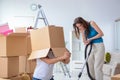 The young family unpacking at new house with boxes Royalty Free Stock Photo