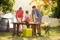 Young family on vacation having barbecue Royalty Free Stock Photo