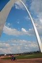 Young family walking under the Gateway Arch
