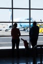 Young family watching planes at an airport