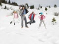 Young Family On Winter Vacation Royalty Free Stock Photo