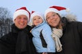 Young Family with X-mas hats Royalty Free Stock Photo