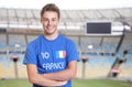 Young fan from France in sports jersey at soccer stadium Royalty Free Stock Photo