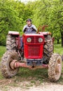 Young farmer driving his tractor Royalty Free Stock Photo