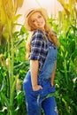 Young farmer girl on corn field. Royalty Free Stock Photo