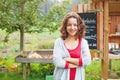 Young farmer girl at food market Royalty Free Stock Photo