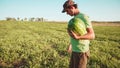 Young farmer harvesting watermelon crop at field of organic farm. Royalty Free Stock Photo