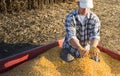 Young farmer holding ripe corns Royalty Free Stock Photo