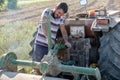 Young farmer preparing the farm tools to start the cultivation of the orchard