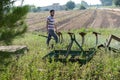 Young farmer preparing the farm tools to start the cultivation of the orchard