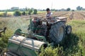 Young farmer preparing the farm tools to start the cultivation of the orchard.