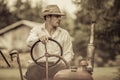 Young Farmer on a Vintage Tractor