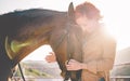 Young farmer woman hugging her horse - Concept about love between people and animals - Focus on pet face Royalty Free Stock Photo