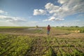 Young farmer woman standing on farmland Royalty Free Stock Photo