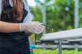 Young farmers are monitoring the hydroponic water system and nutrients in order to control the quality of organic vegetables to