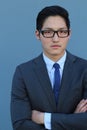 Young fashion Asian man wearing suit, tie and glasses with space for copy Royalty Free Stock Photo