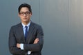 Young fashion Asian man wearing suit, tie and glasses with space for copy Royalty Free Stock Photo