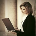 Young fashion business woman with laptop at office building Royalty Free Stock Photo