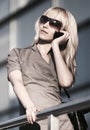 Young fashion business woman talking on cell phone at office building Royalty Free Stock Photo